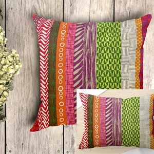 Multi-coloured mini cushions with Australian Aboriginal art prints