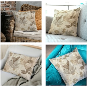 May include: Four throw pillows with a beige floral pattern on a variety of couches. The pillows are made of a soft, linen-like fabric and feature a subtle floral design in shades of brown and beige.