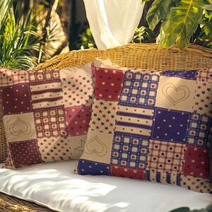May include: Two square throw pillows featuring a patchwork design with alternating squares of red, blue, and cream. The patterns include small stars, checkered grids with tiny hearts, and outlined heart shapes on a solid cream background.