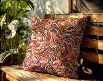 May include: A square throw pillow featuring a vibrant, abstract pattern of swirling, organic shapes in shades of burnt orange, deep red, soft pink, and cream, accented with small white dots throughout the intricate, layered design.