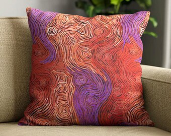 May include: A square throw pillow featuring a vibrant abstract pattern of swirling lines and concentric circles in shades of deep red, burnt orange, and bright purple. The design covers the entire front surface with a dense, textured appearance.