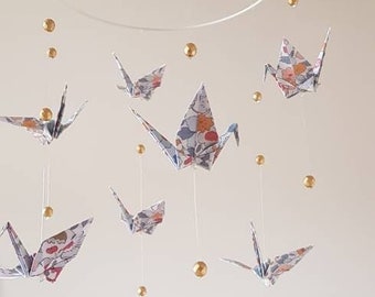 Origami mobile for baby's crib with cranes and beads, pattern liberty betsy and gold faceted beads