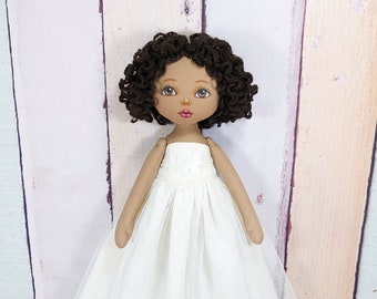 Handmade rag doll in a white removable ball gown.