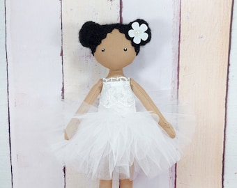 Little ballerina doll made of black fabric.