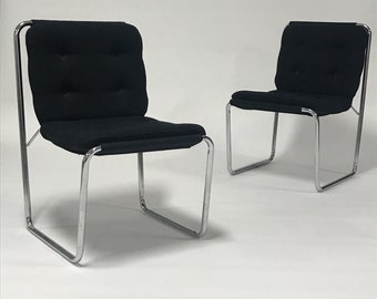 Pair of black upholstered tubular steel Cosco sling chairs