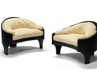 A pair of Henry P Glass intimate island lounge chairs