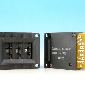 May include: A black electrical relay with three dials labelled "6", "D", and "3". The relay has a label that reads "СДЕЛАНО В СССР ППИО - 3 МаВ 8902".