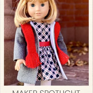 May include: A doll with blonde hair, a red hair bow, and blue eyes. The doll wears a grey coat, a red knit scarf, and a black, white, and red plaid dress with a red waistband. A silver necklace is visible. Text reads: MAKER SPOTLIGHT Created by Diana M.