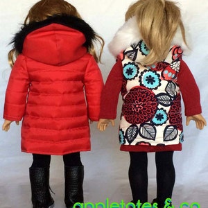 May include: Two dolls wearing winter clothing. The doll on the left is wearing a red puffer jacket with a black fur hood and black leggings. The doll on the right is wearing a red and white floral vest with a white fur collar and black leggings.