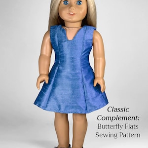 May include: A blue sleeveless dress with a V-neckline on a doll with blonde hair. The doll is wearing sparkly silver shoes. The text "Classic Complement: Butterfly Flats Sewing Pattern" is below the doll. The text "appletotes & co." is at the bottom of the image.
