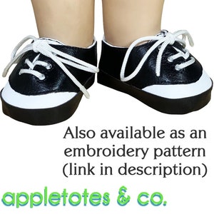 May include: A pair of black and white sneakers with white laces. The shoes have a white trim around the top and a black sole. Also available as an embroidery pattern (link in description) appletotes & co.