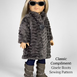May include: A gray faux fur coat with a black button and a flower design. The doll is wearing blue jeans and gray boots with silver chains. The text "Classic Compliment: Gisele Boots Sewing Pattern" is below the doll. The text "appletotes & co." is at the bottom of the image.