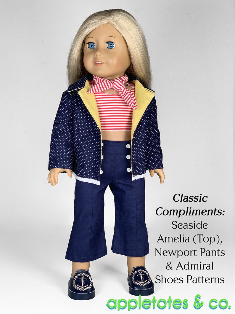 May include: A doll wearing a blue and white polka dot jacket with yellow trim, a red and white striped top, blue pants, and black shoes with an anchor design. The doll is wearing a red and white striped scarf. The text "Classic Compliments: Seaside Amelia (Top), Newport Pants & Admiral Shoes Patterns appletotes & co." is below the doll.
