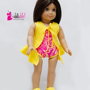 May include: A doll wearing a yellow sleeveless vest over a pink and gold patterned swimsuit. The doll is wearing yellow clogs. The image includes the text "Addollable! Adorable Doll Clothing."