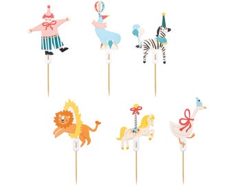 May include: Set of 6 colorful circus-themed cake toppers. The toppers feature a clown, a zebra, a lion, a carousel horse, a goose, and a hot air balloon. The toppers are made of cardboard and have a stick on the back for easy insertion into cakes.