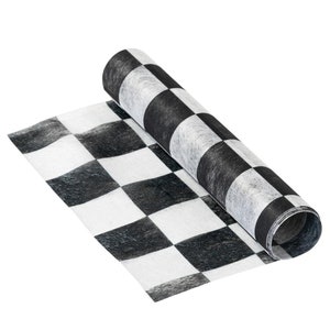 May include: A black and white checkered fabric roll, perfect for crafting or decorating. The fabric is rolled up and the checkered pattern is visible.