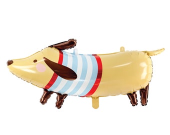 May include: A yellow and brown dachshund balloon with blue and red stripes. The balloon has a cute face with brown ears and a pink nose.