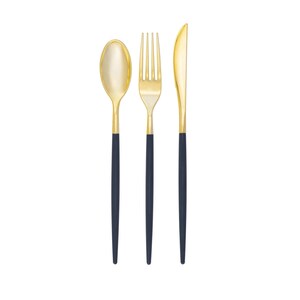 May include: A set of gold-colored flatware with black handles. The set includes a fork, knife, and spoon.