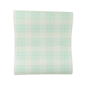 May include: A roll of white wallpaper with a light green plaid pattern.