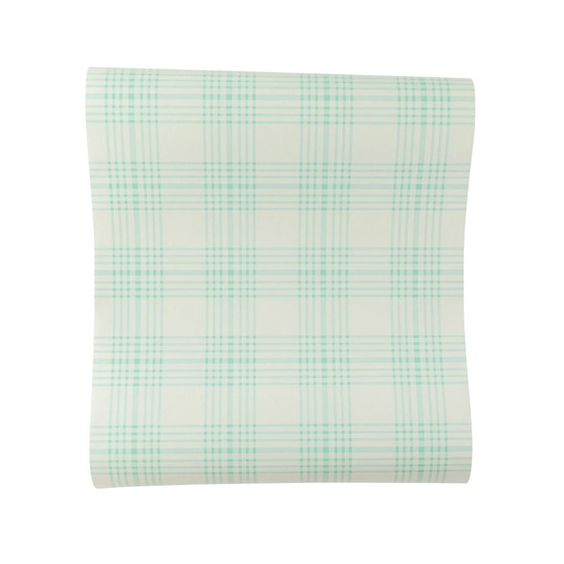 May include: A roll of white wallpaper with a light green plaid pattern.