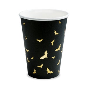 May include: Black paper cup with a gold bat pattern.