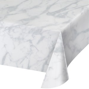 May include: White plastic tablecloth with a gray marble pattern.