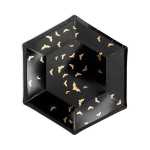 May include: Black hexagonal paper plates with a gold bat pattern.