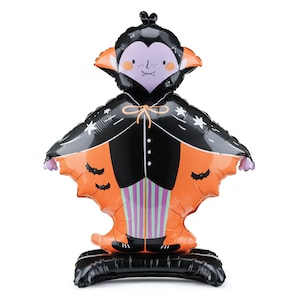 May include: A black and orange inflatable Halloween vampire with a cape, fangs, and a purple face. The vampire has a black base.