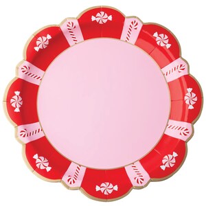 May include: A round scalloped paper plate featuring a solid light pink center. The wide border displays alternating red and light pink sections decorated with white peppermint candy illustrations and white and red striped candy cane patterns.