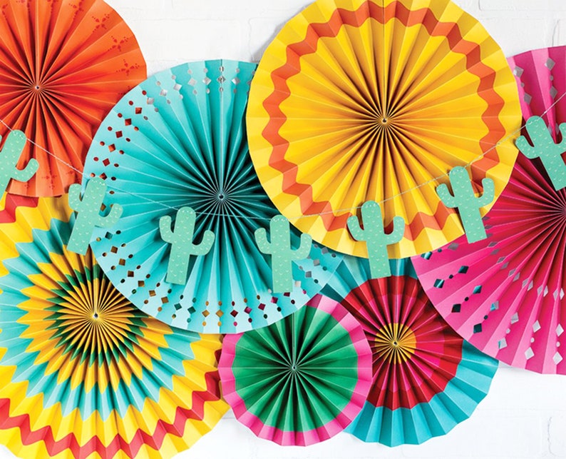 May include: A set of colorful paper fans with a cactus garland. The fans are in shades of orange, yellow, green, blue, and pink. The garland is made of green paper cutouts of cacti.