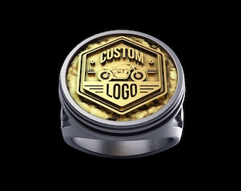 May include: A gold ring with a custom logo featuring a motorcycle and the text "CUSTOM LOGO" with the dates "EST 2021" and "2024" on either side of the motorcycle.