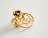 vintage gold tone rose brooch . blue stone floral pin . retro metal costume jewelry