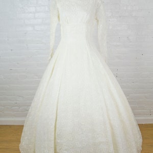 Callie 1950s wedding dress . 50s white cut out eyelet lace and wedding gown with long sleeves and bustle . small