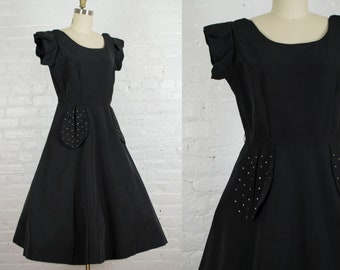 1950s dress . vintage 50s black faille party cocktail dress with rhinestone pockets . medium