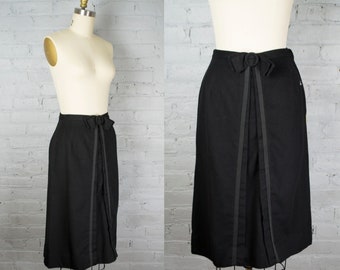 1950s skirt. vintage 50s high waist pencil skirt . black wool midi skirt with bow . small