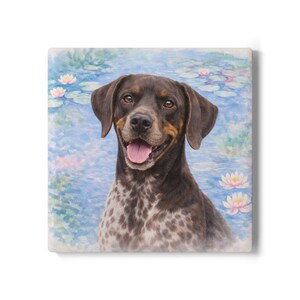 May include: A square decorative tile featuring a portrait of a dog with brown and white spotted fur, brown ears, and a happy expression. The background shows a serene water scene with lily pads and flowers.