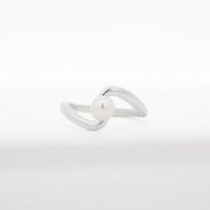 May include: A silver ring with a single white pearl set in a curved band.