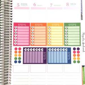 May include: A weekly planner page with colorful stickers for tracking steps. The stickers feature hearts, days of the week, and the word "STEPS".