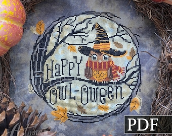 May include: A cross stitch pattern featuring an owl wearing a witch's hat and the text "Happy Halloween". The pattern is surrounded by a wreath of fall leaves and branches. The pattern is available as a PDF download.