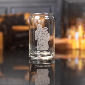 May include: A clear glass can with a photo of two men etched into the side. The text "Groomsmen" is also etched into the glass.