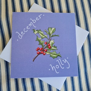 Tarjeta de acebo de diciembre
