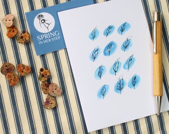 Tarjeta de felicitación con pluma azul