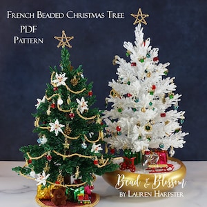 May include: Two beaded Christmas trees, one green and one white, are displayed. The green tree has gold garland, red and white accents, and a gold star topper. The white tree features red, green, and gold ornaments and a gold star. The text reads "French Beaded Christmas Tree PDF Pattern."