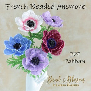 May include: A bouquet of five beaded anemones in various colours, including white, pink, blue, purple, and red, with green beaded leaves. The flowers are arranged in a white vase. The text "French Beaded Anemone" is at the top of the image, and the text "PDF Pattern" is in the lower right corner. The text "Bead & Blossom by Lauren Harpster" is in the lower centre of the image.