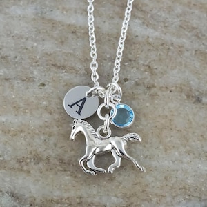 Personalized horse necklace with a custom initial and birthstone charm.