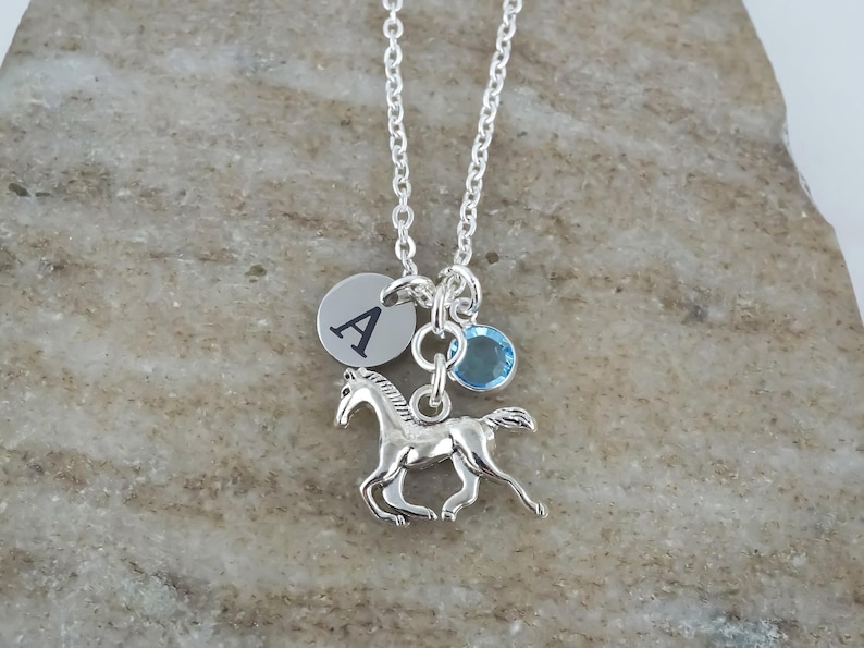 Personalized horse necklace with a custom initial and birthstone charm.