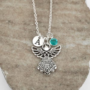 Personalized angel necklace with a custom initial and birthstone charm.