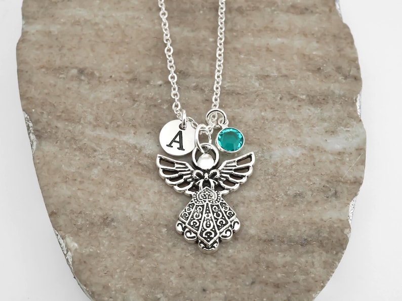 Personalized angel necklace with a custom initial and birthstone charm.