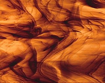 May include: A sheet of dichroic glass with a swirling pattern of brown and orange colors.