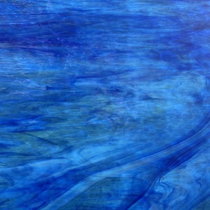 May include: Abstract blue and green stained glass with a swirling pattern.